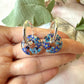 Denim Donut bloom earrings.
