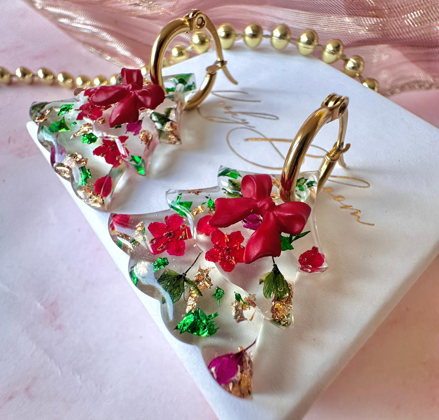 Bloom bow Christmas Tree earrings.