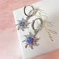 Silver Purple Opal Sun Huggie hoop earrings.