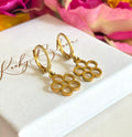 Gold tiny hollow flower huggie earrings.