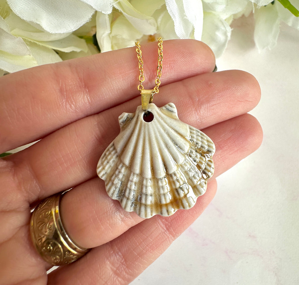 Gold ceramic seashell necklace.