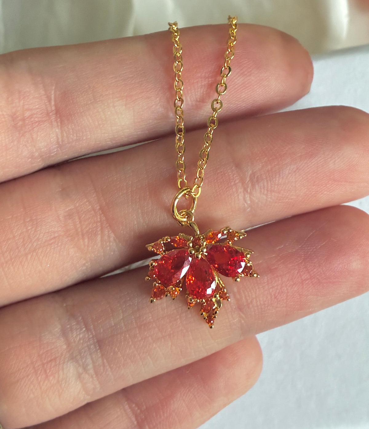 Gold CZ Autumn leaf necklace.