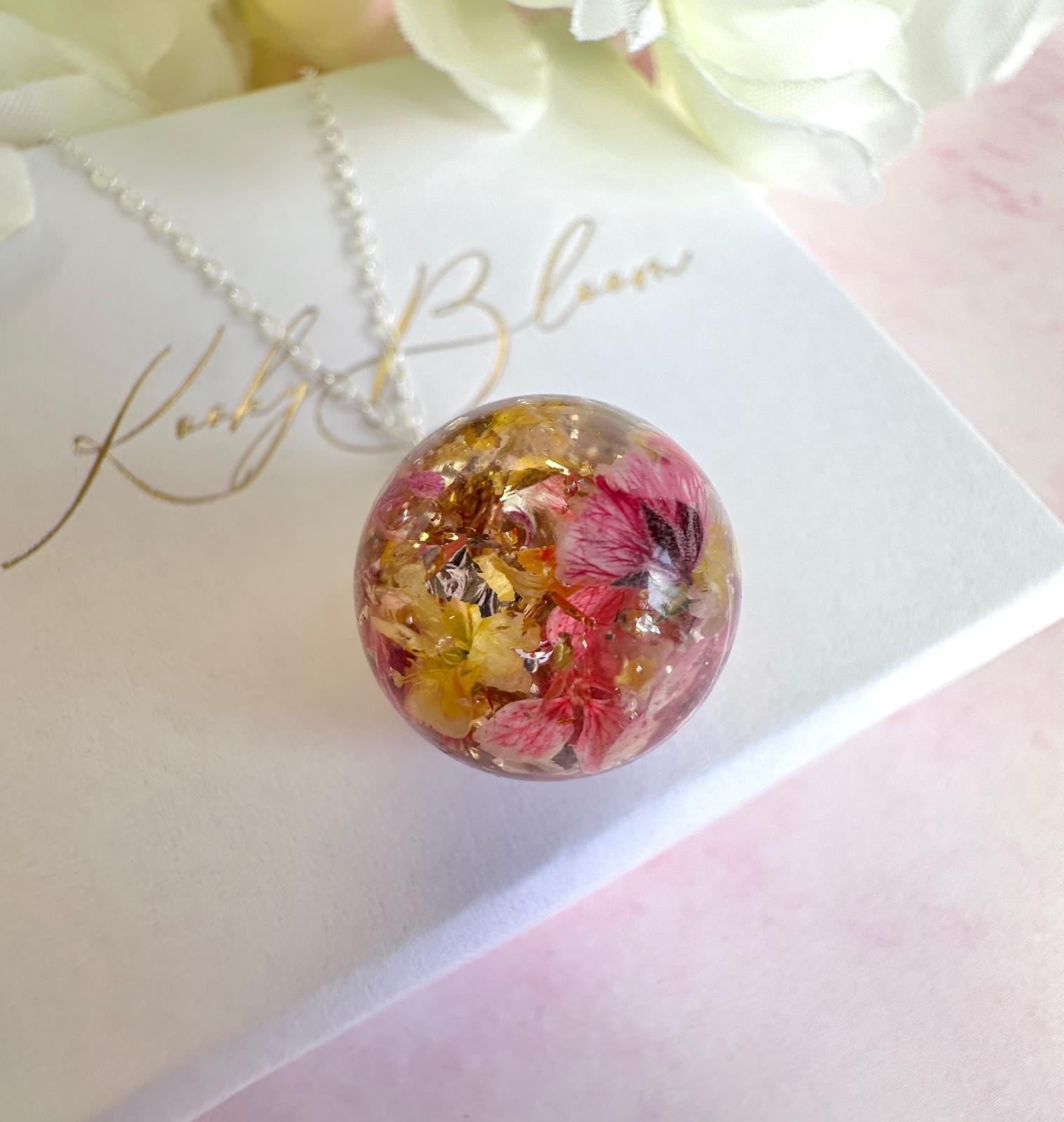 Silver Flower confetti Globe necklace.