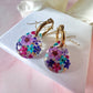 Purple Rain Bloom Teardrop hoop earrings.