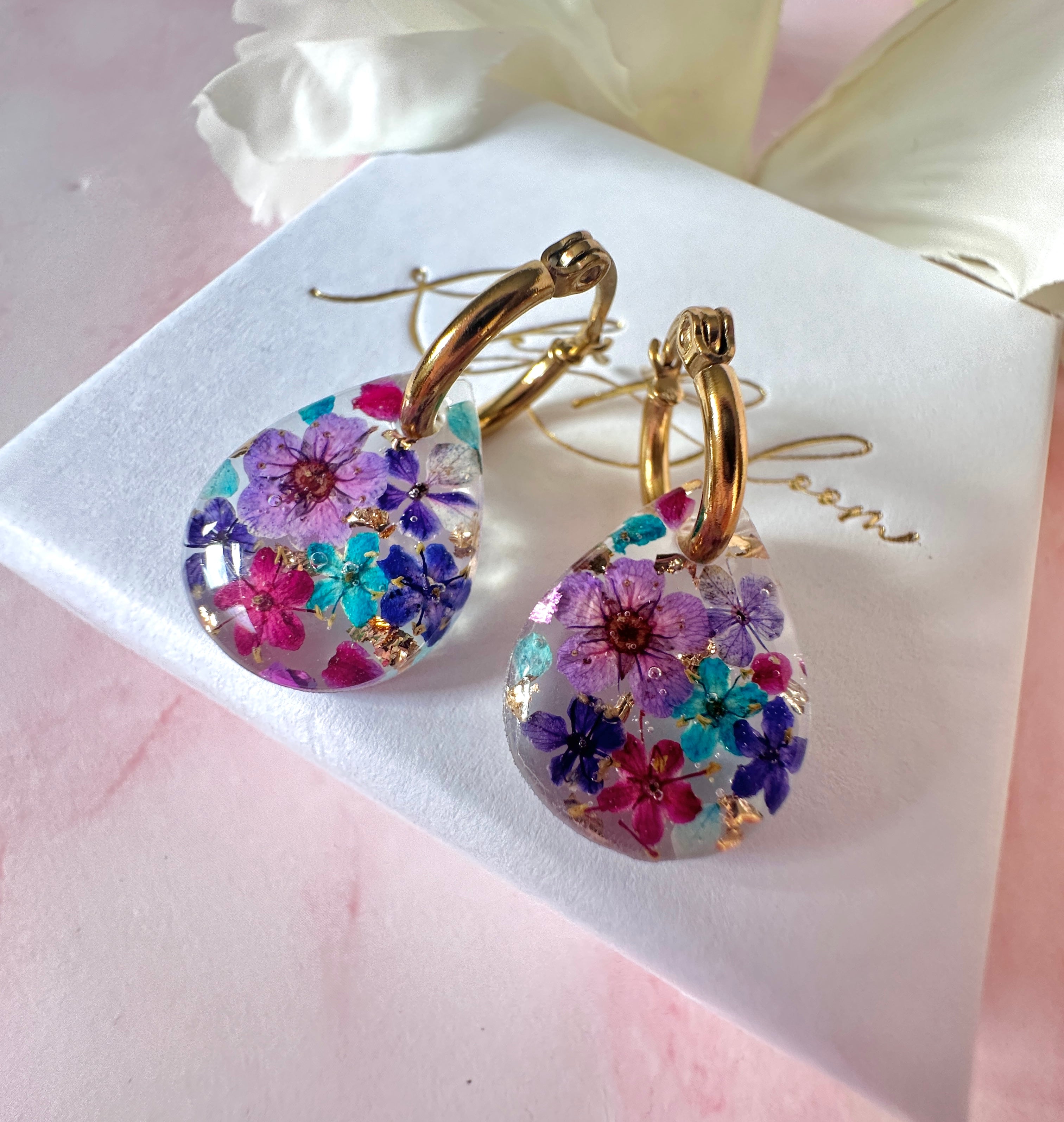 Purple Rain Bloom Teardrop hoop earrings.
