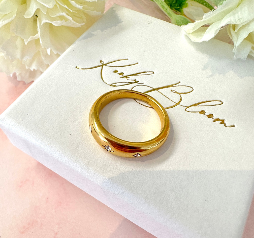 Gold Triple CZ domed band ring.