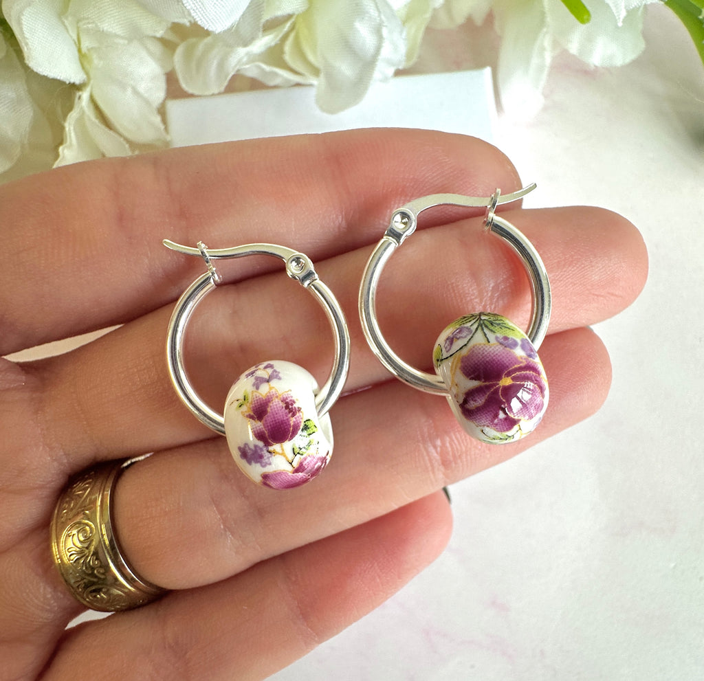 Silver Purple floral ceramic bead hoop earrings.