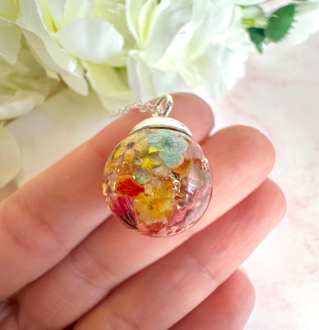 Silver Flower confetti Globe necklace.