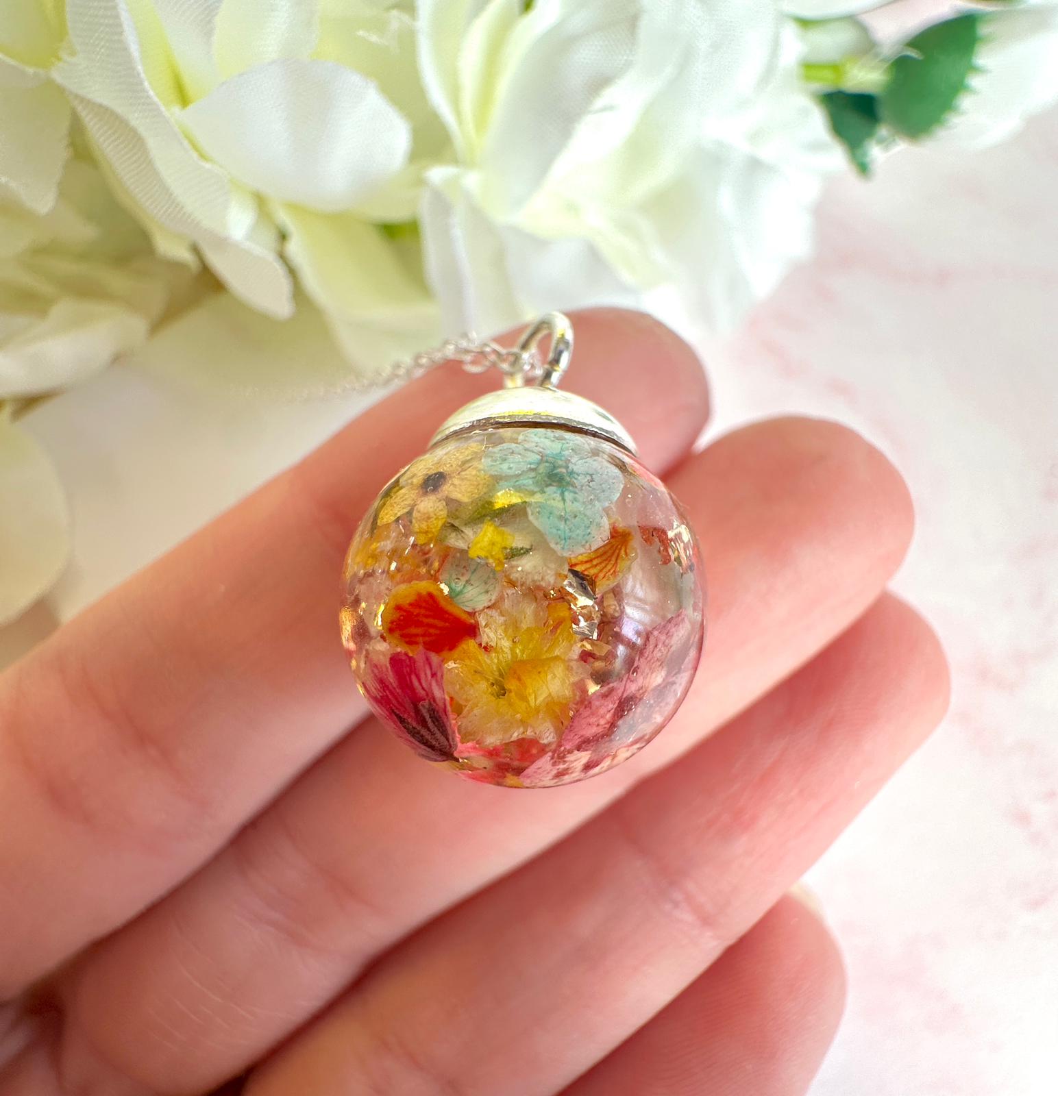Silver Flower confetti Globe necklace.