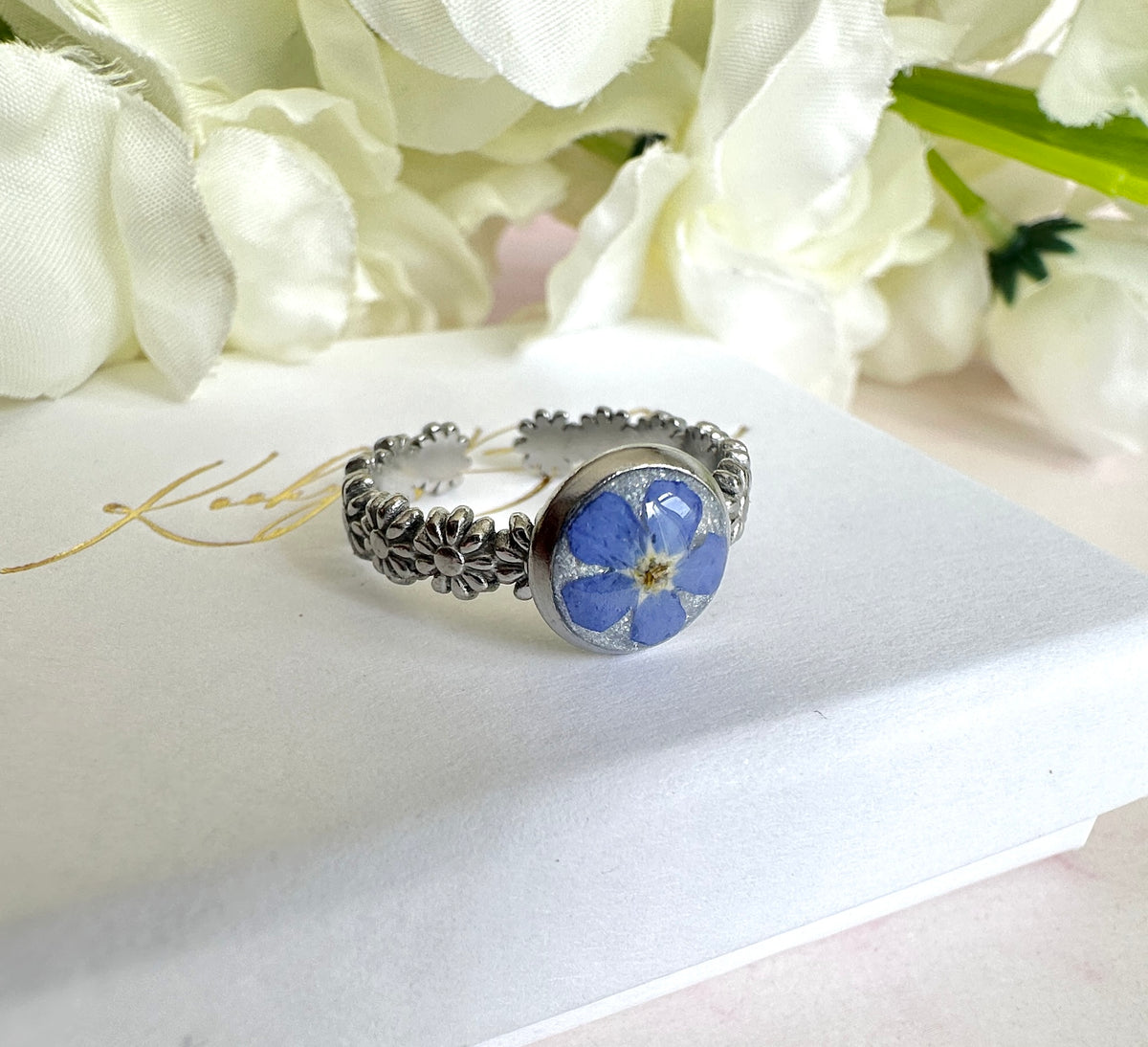 Silver forget me not flower adjustable band ring.