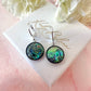 Silver Shell disc huggie earrings.