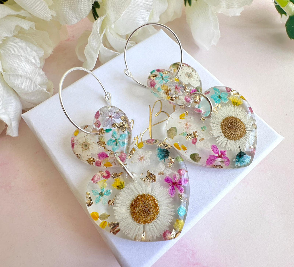 Daisy confetti double heart drop hoop earrings.