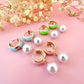 Gold Enamel Pearl drop Huggie earrings.