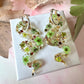 Snake real flower hoop earrings.