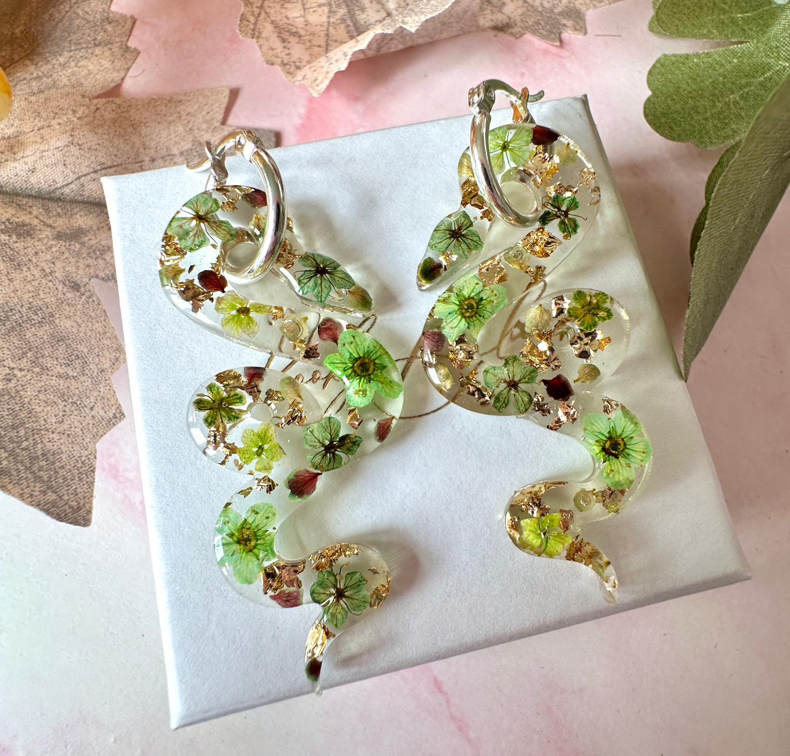 Snake real flower hoop earrings.