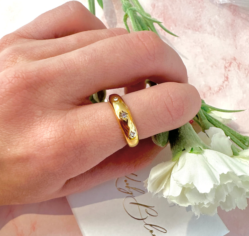 Gold Triple CZ domed band ring.