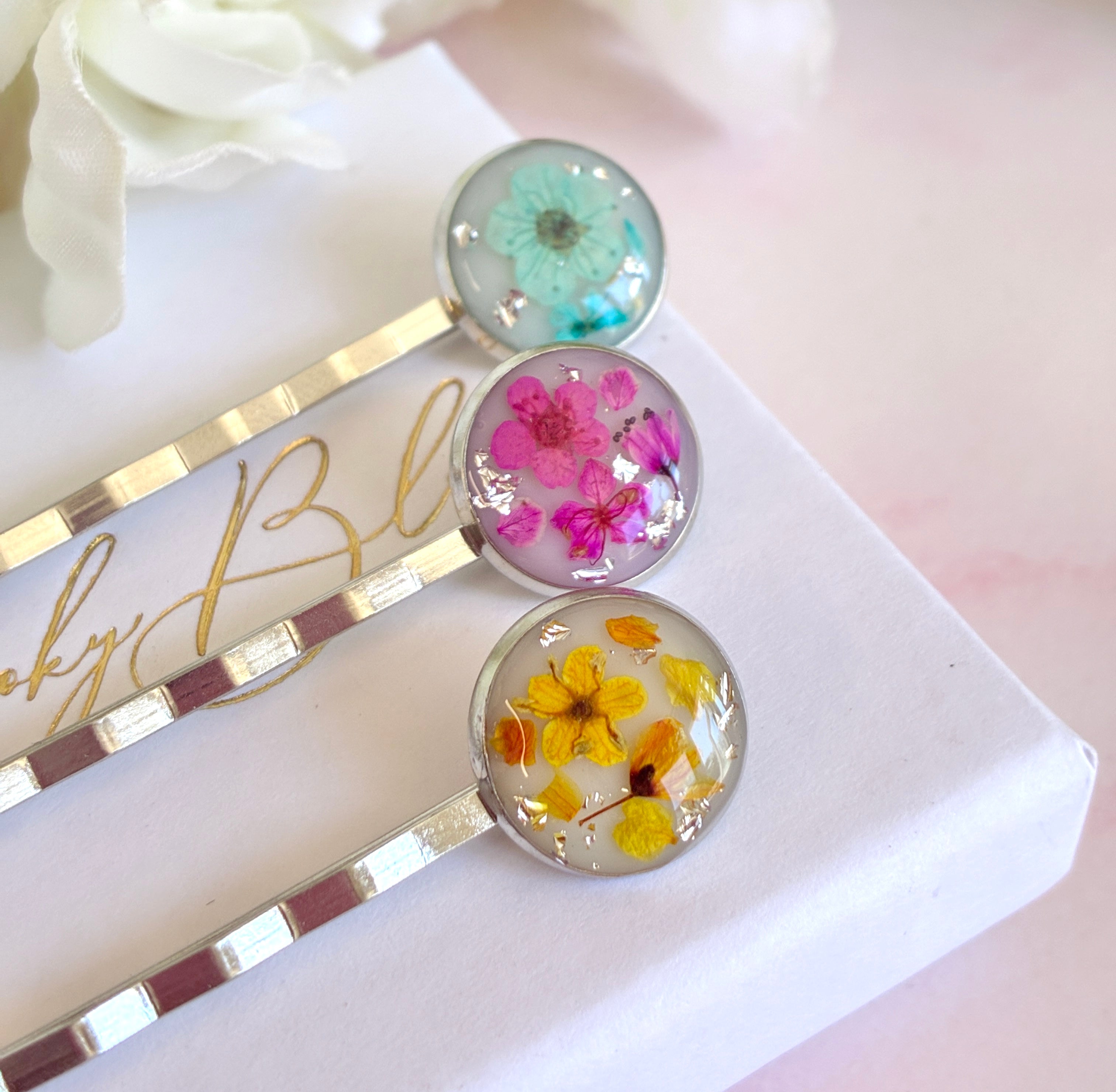Silver set of 3 Bloom flower hair slides.