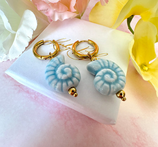 Blue ceramic seashell hoop earrings.