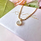 Gold Pearlescent pendant necklace.