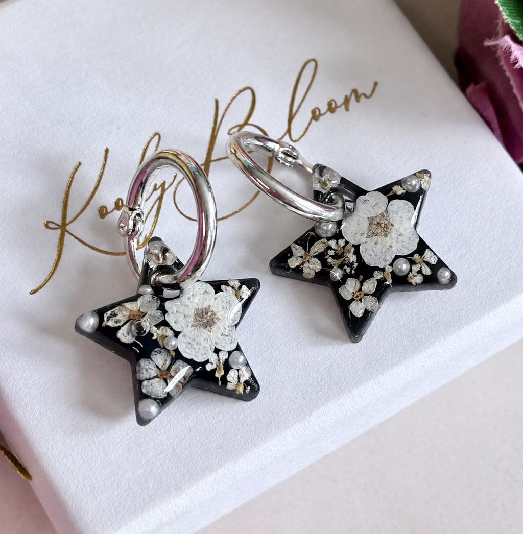 Midnight Pearl Star bloom hoop earrings.