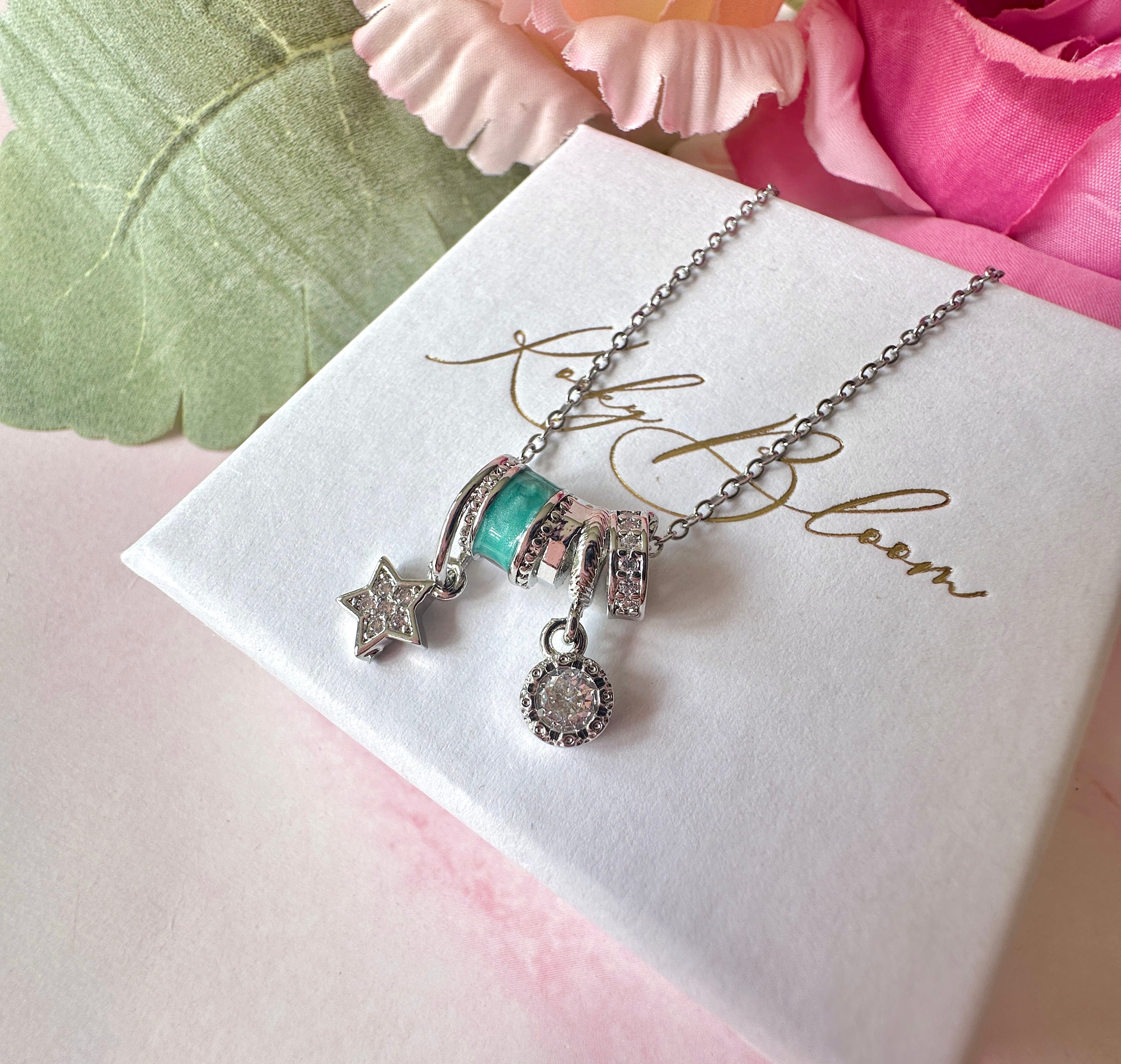 Silver Aqua Star cz Charm cluster necklace.