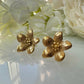 Gold oversized Flower stud earrings.