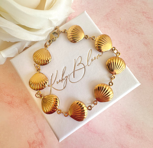 Gold shell bracelet.