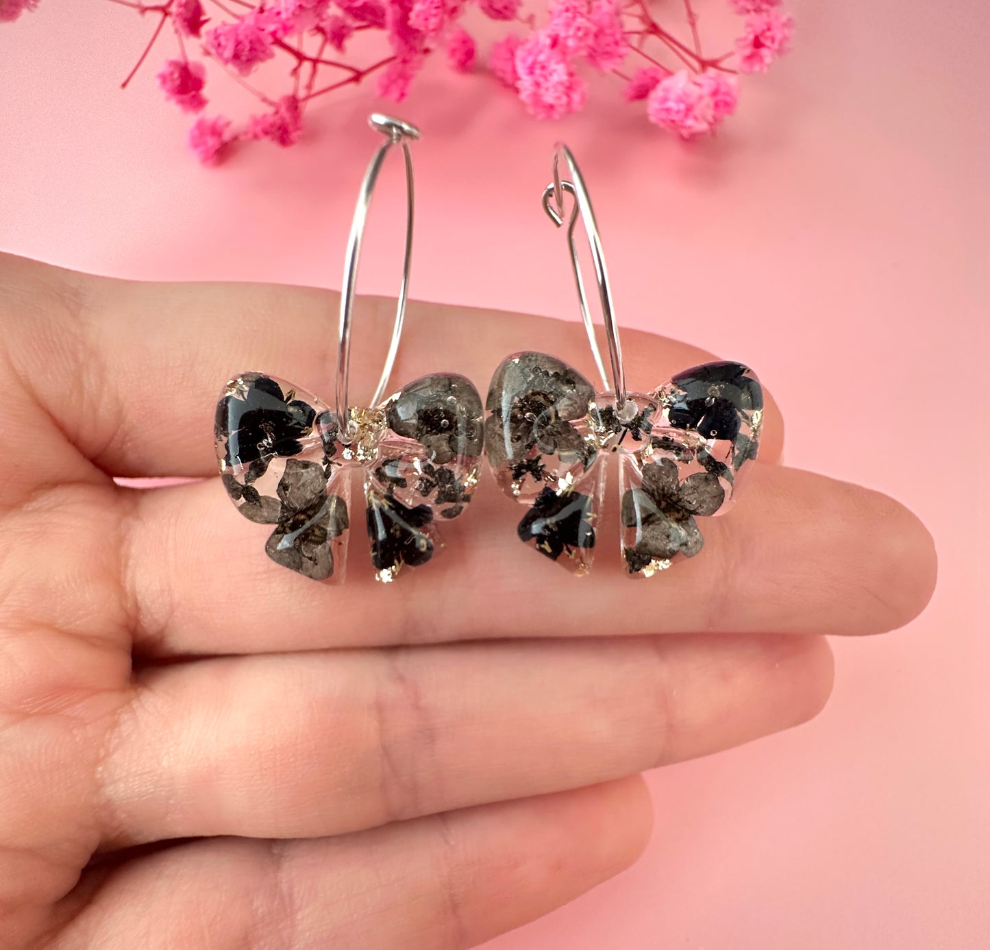 Black ebony Bloom Bow hoop Earrings.