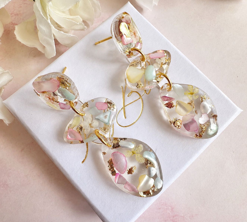 Pastel Seashell & Bloom pebble drop stud earrings.