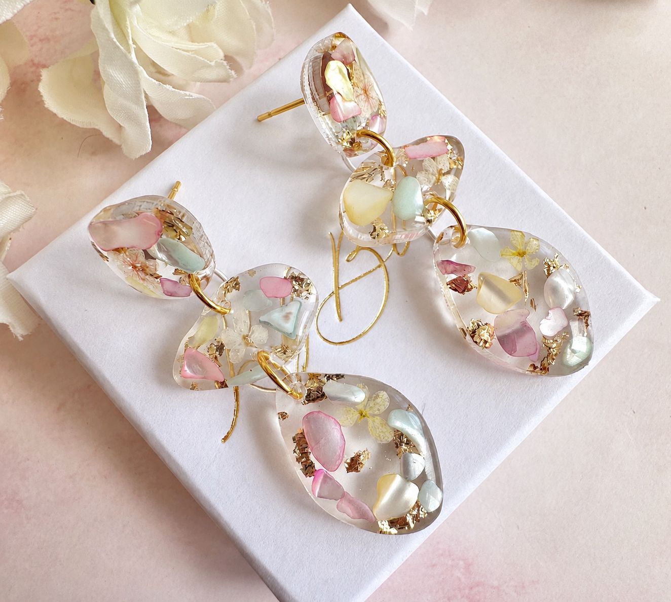 Pastel Seashell & Bloom pebble drop stud earrings.