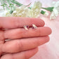 925 Sterling silver peach opal pink cz stud earrings.