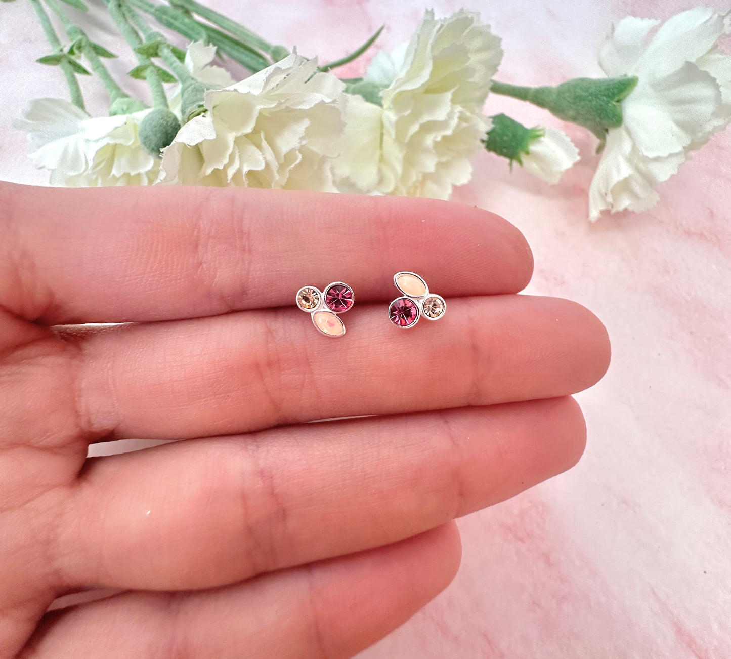 925 Sterling silver peach opal pink cz stud earrings.