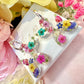 Balloon Dog bloom hoop earrings.