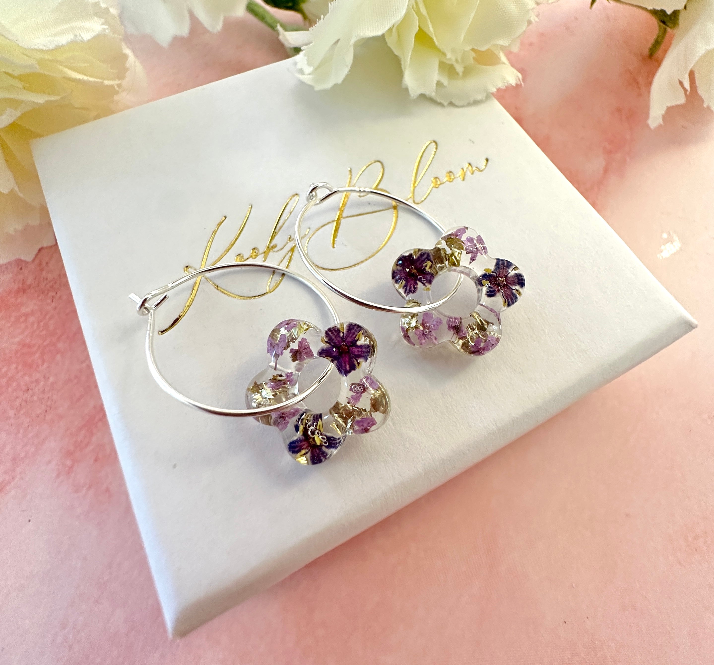 Tiny Purple bloom flower earrings.