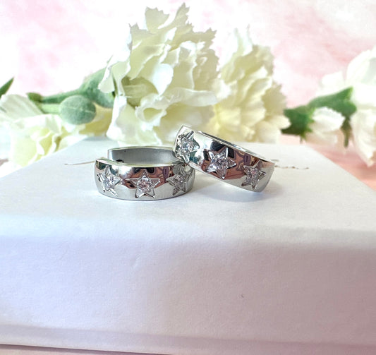 Small Silver Chunky clear CZ star Huggie earrings.