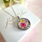 Silver Real flower capsule locket necklace.