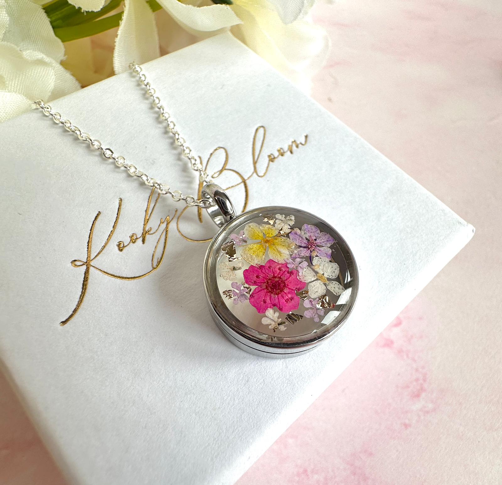 Silver Real flower capsule locket necklace.