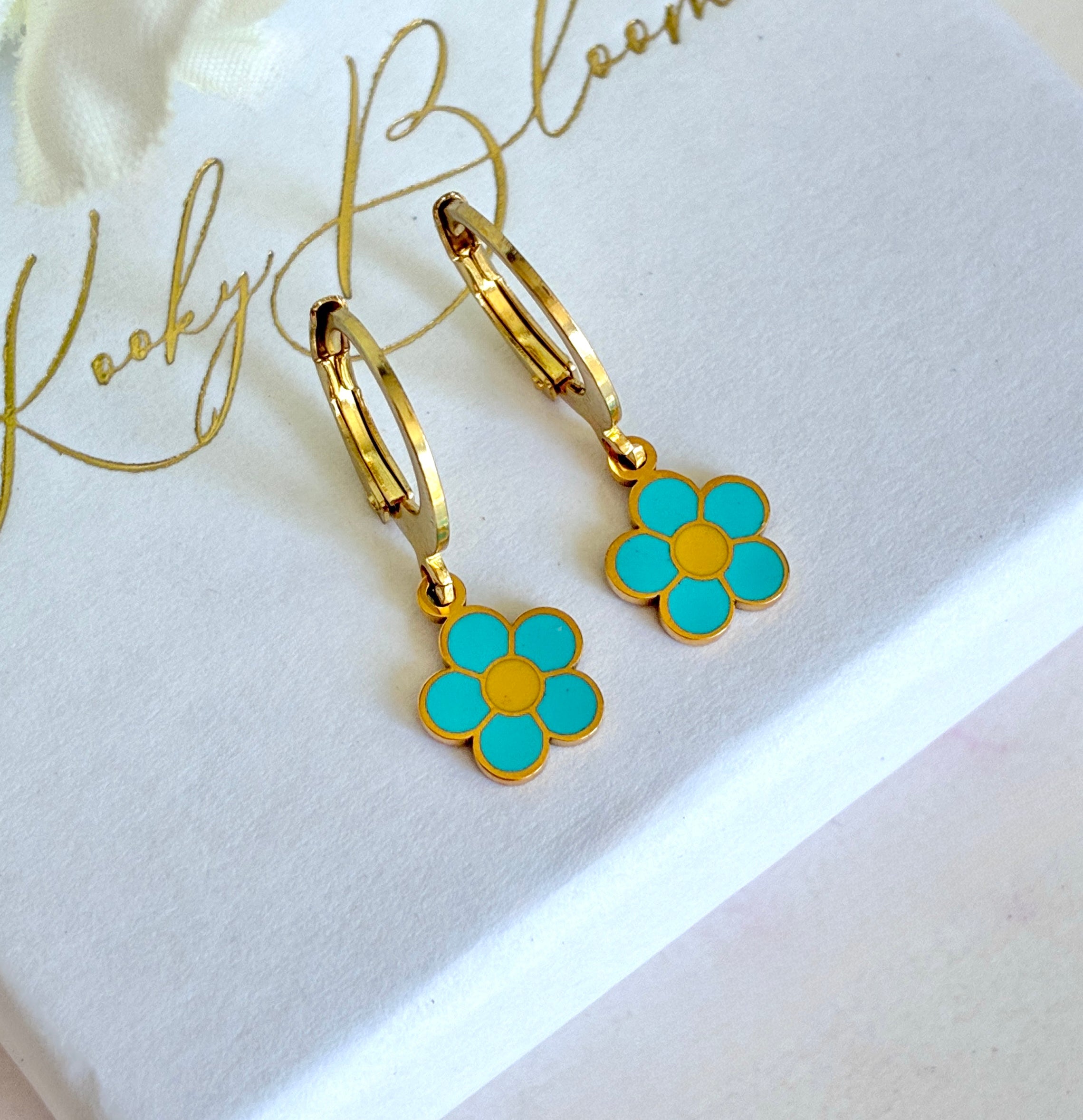 Gold tiny Blue daisy huggie earrings.