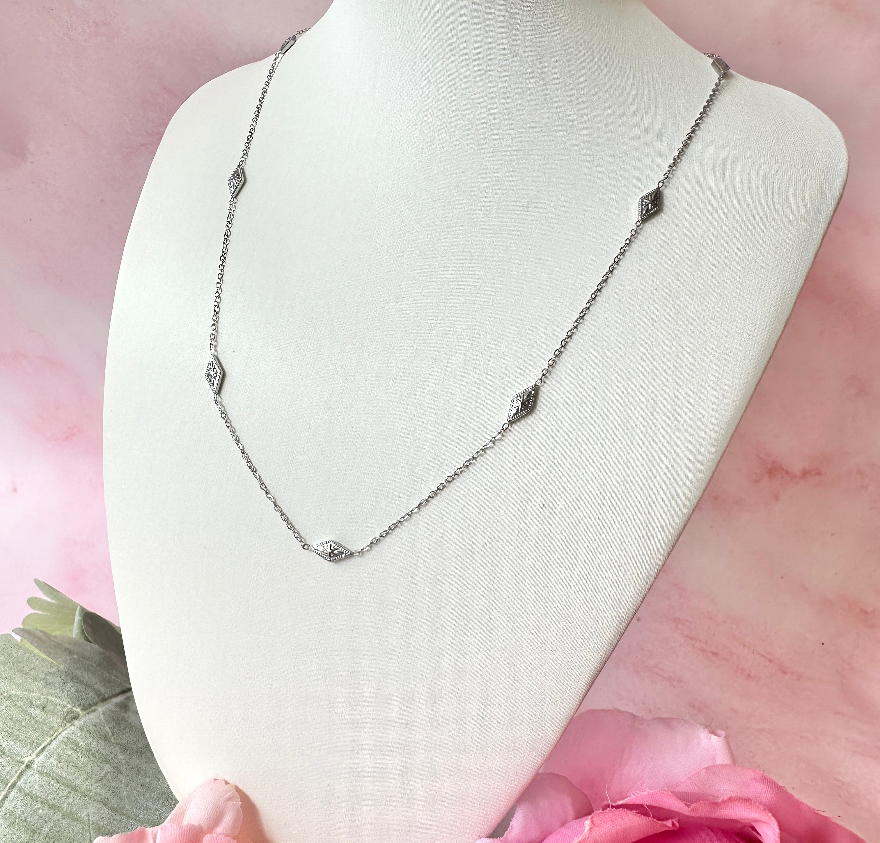 Silver dainty engraved star diamond necklace.