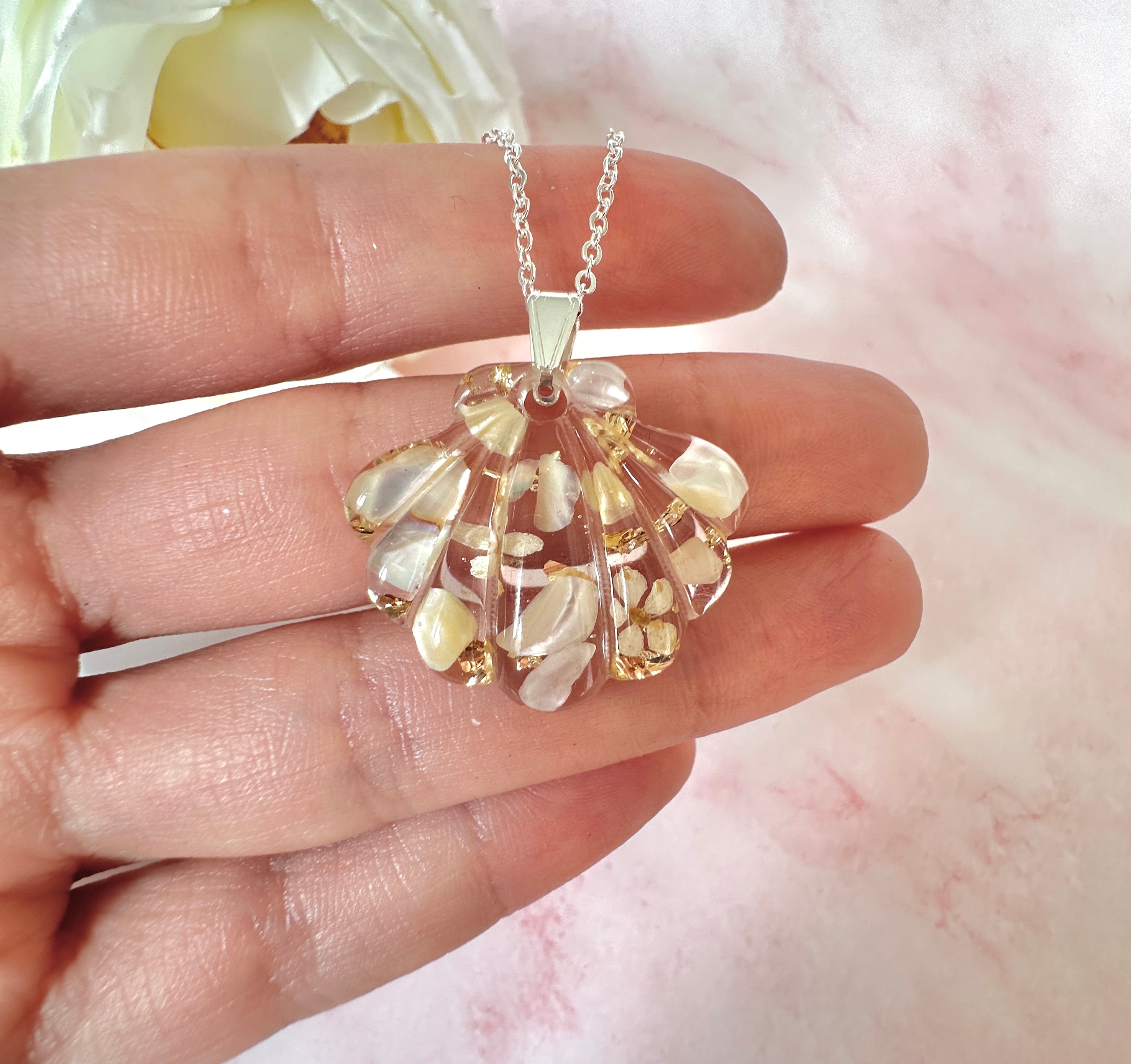 Silver Champagne Seashell Bloom necklace.