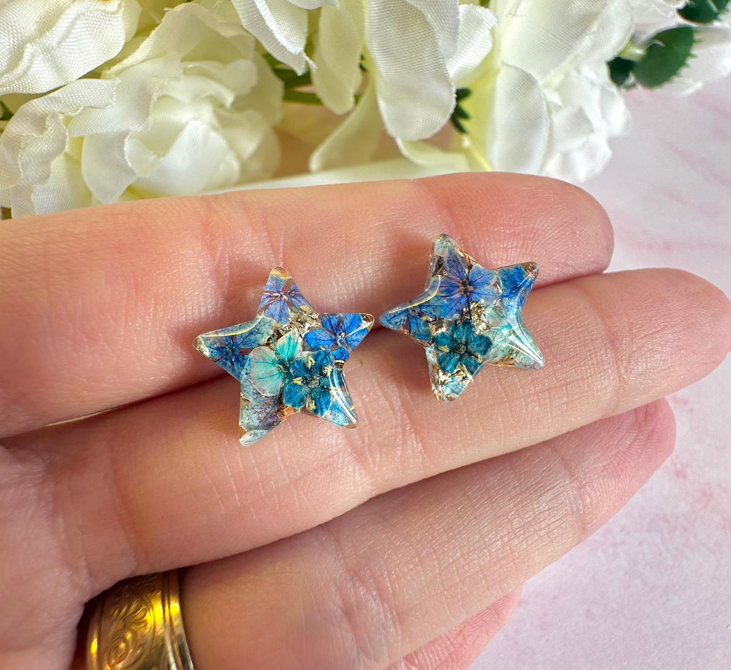 Blue Bloom Star 925 sterling stud earrings.