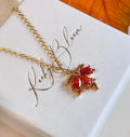 Gold CZ Autumn leaf necklace.