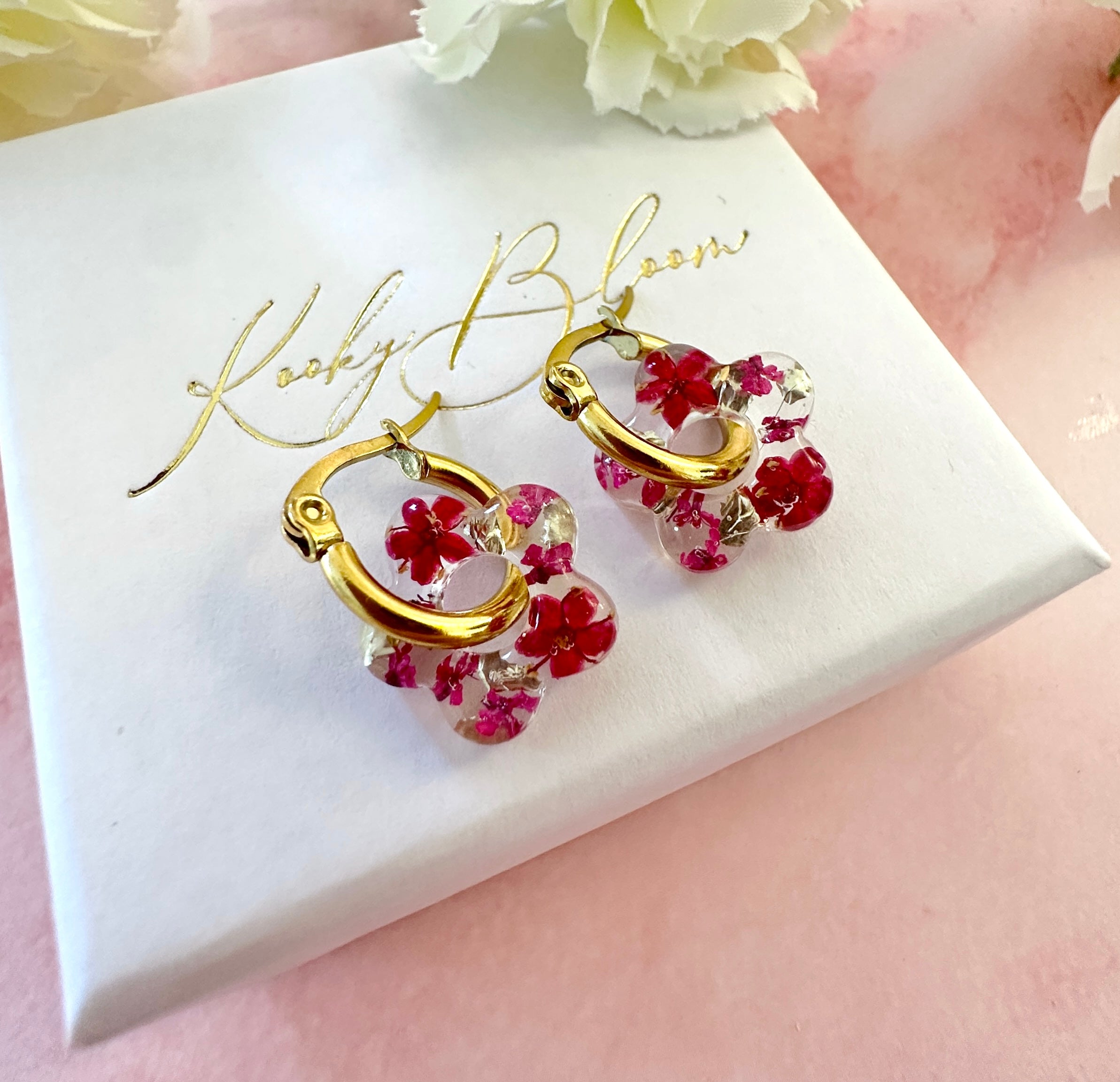 Tiny Dark Pink bloom flower earrings.