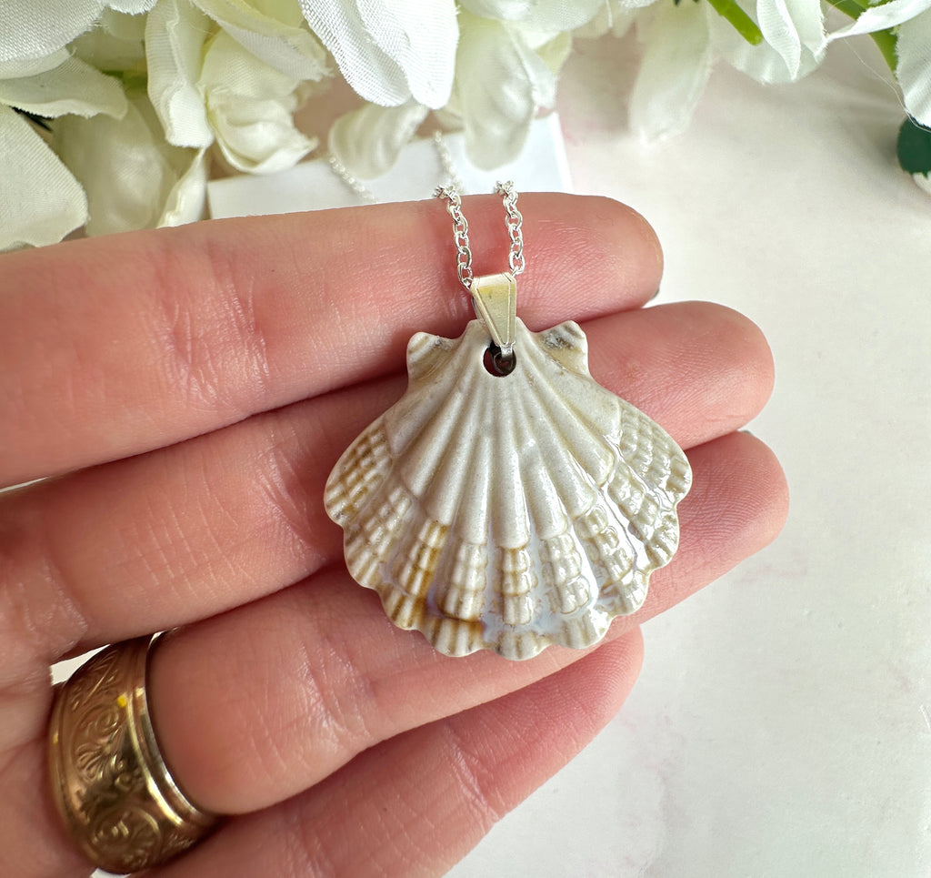 Silver ceramic seashell necklace.