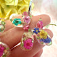 Balloon Dog bloom hoop earrings.