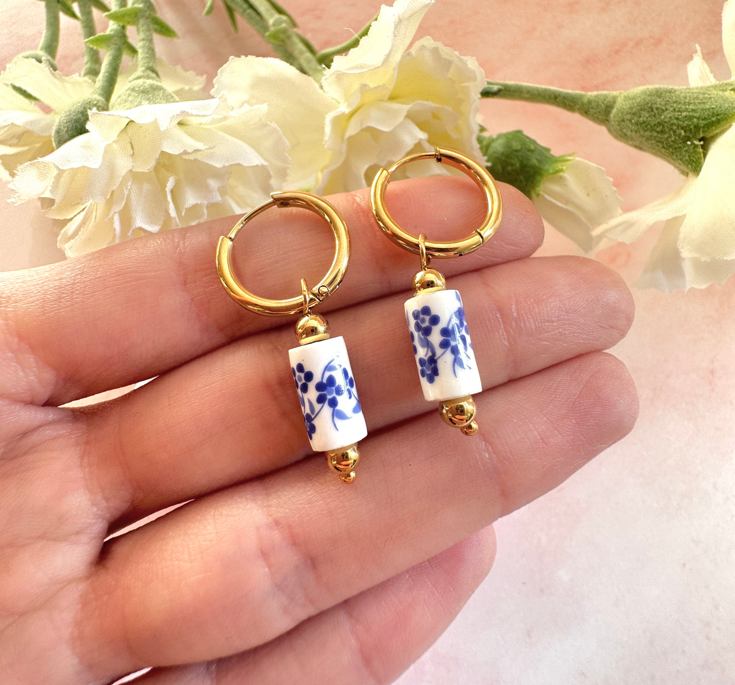 Gold blue floral ceramic bead earrings.