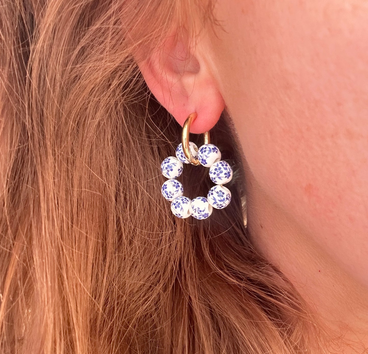 Gold Blue White floral bead ring hoop earrings.