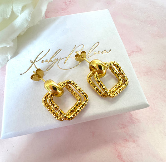 Gold sparkle double square stud earrings.