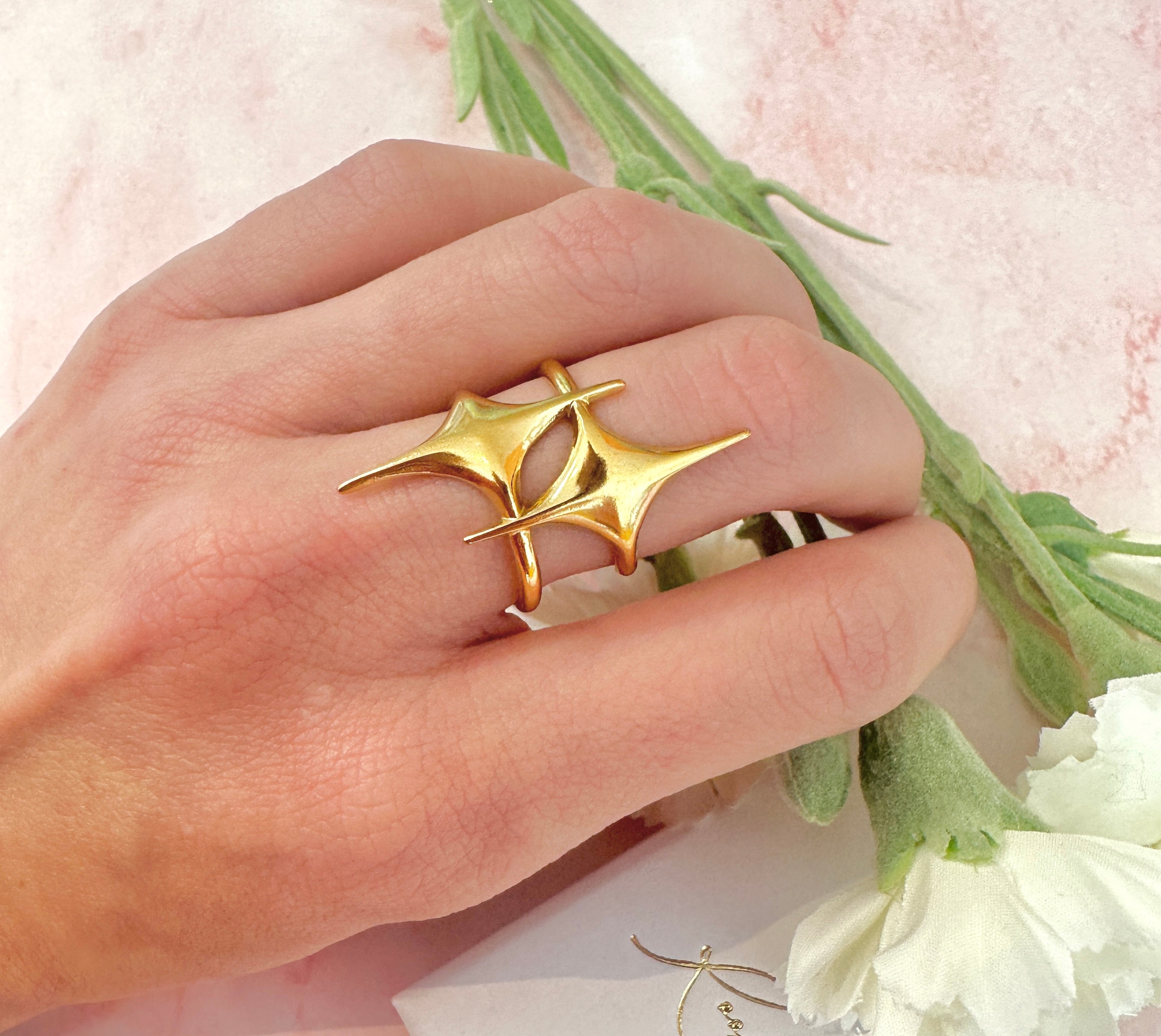 Gold statement double star adjustable ring.