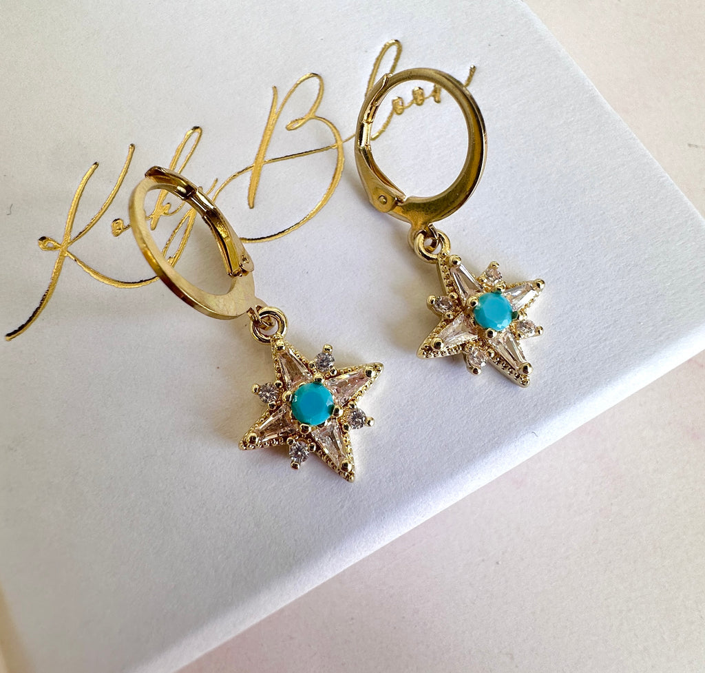 Gold Tiny Cz Blue stone Star huggie earrings.